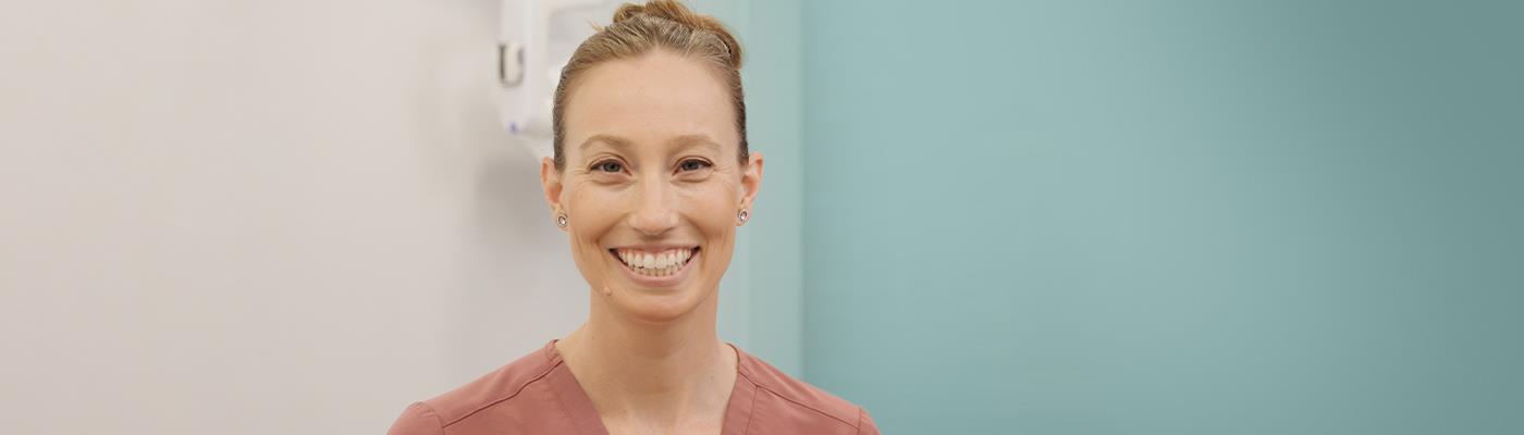 womans mouth with dental tools